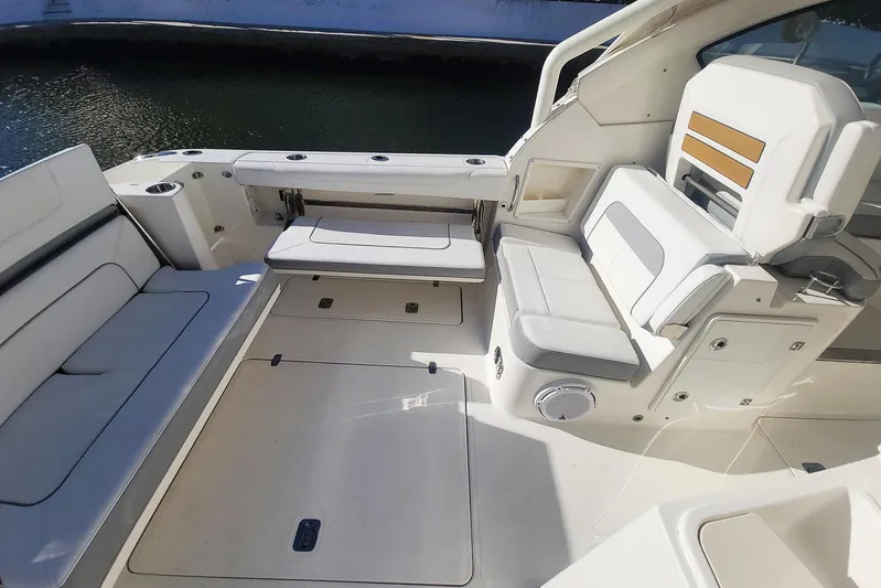  Yacht Photos Pics 2021 Pursuit DC 326 Dual Console boat interior with spacious seating and storage.