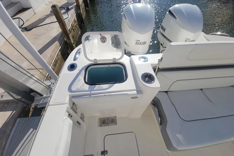  Yacht Photos Pics 2021 Pursuit DC 326 Dual Console boat with Yamaha engines, docked by the water.