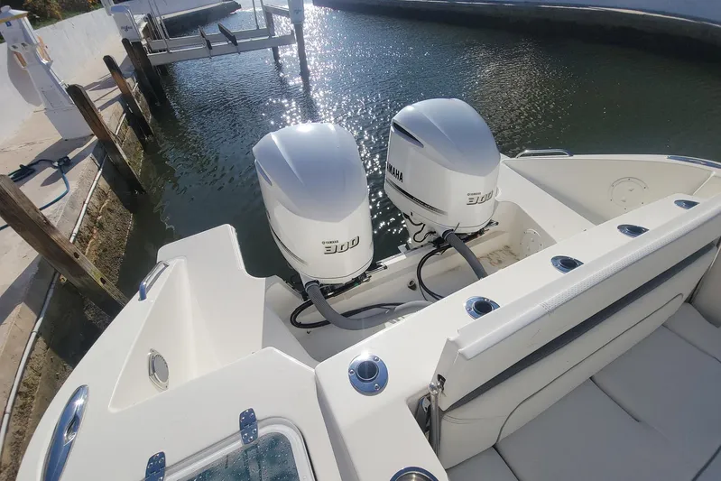  Yacht Photos Pics 2021 Pursuit DC 326 Dual Console boat with twin Yamaha 300 engines docked by water.