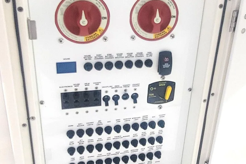  Yacht Photos Pics Control panel of a 2021 Pursuit DC 326 Dual Console boat with switches and dials.