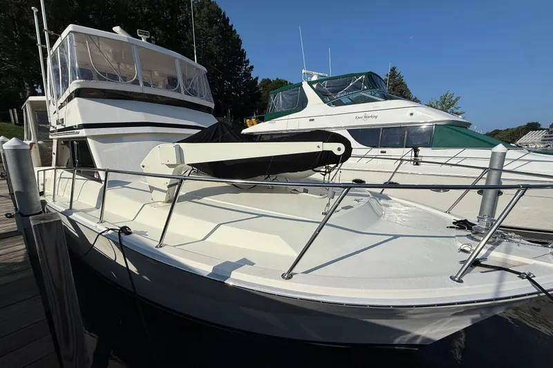 Last Dance Yacht Photos Pics 1989 Viking Boats 44 Motor Yacht docked, featuring sleek design and spacious deck.