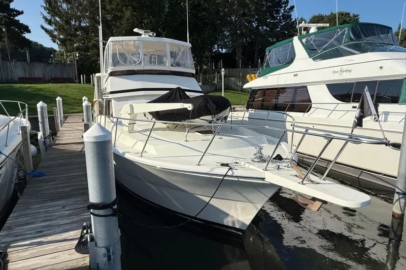 Last Dance Yacht Photos Pics 1989 Viking Boats 44 Motor Yacht docked at marina, surrounded by other boats.