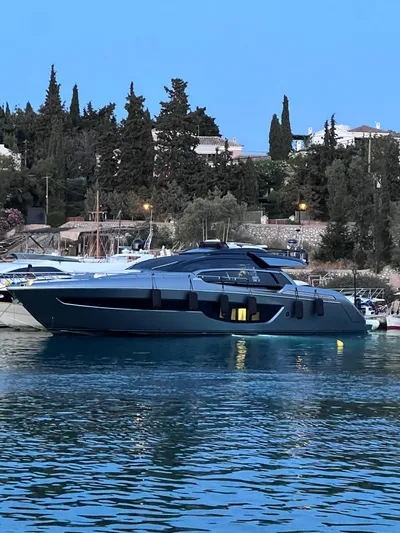  Yacht Photos Pics Luxury 2022 Riva 76' Perseo Super yacht docked in serene waters.