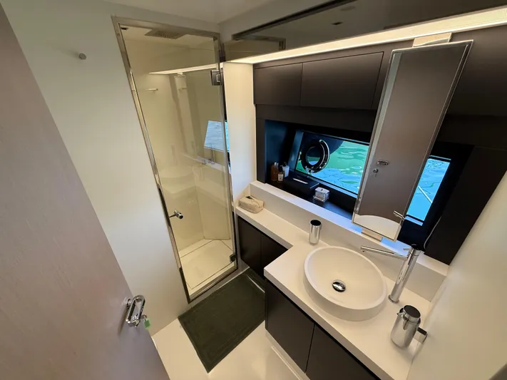  Yacht Photos Pics Luxurious bathroom on 2022 Riva 76' Perseo Super yacht with modern fixtures and ocean view.