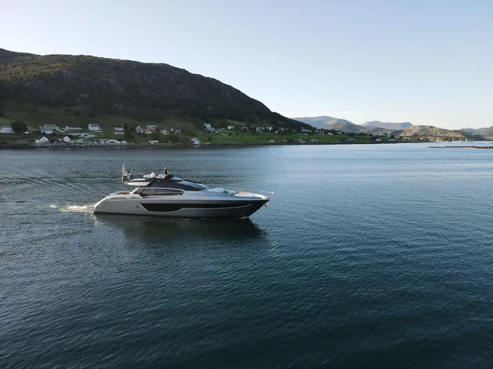  Yacht Photos Pics Luxury Riva 76' Perseo Super yacht cruising on serene waters, 2022 model.