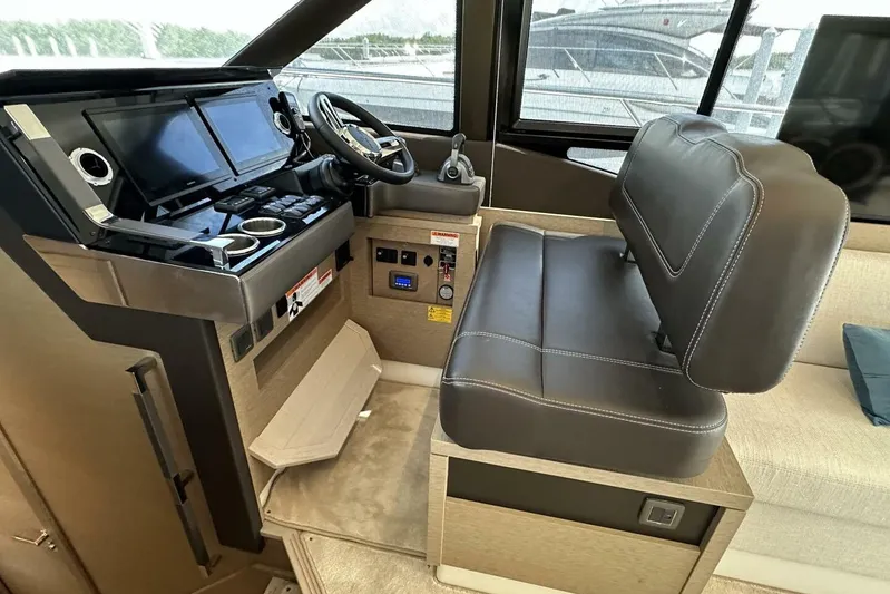 Our Trade Yacht Photos Pics 2024 Prestige 460 yacht helm with dual screens and leather seating.