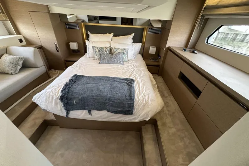 Our Trade Yacht Photos Pics Luxurious bedroom interior of 2024 Prestige 460 yacht with modern design and cozy bedding.
