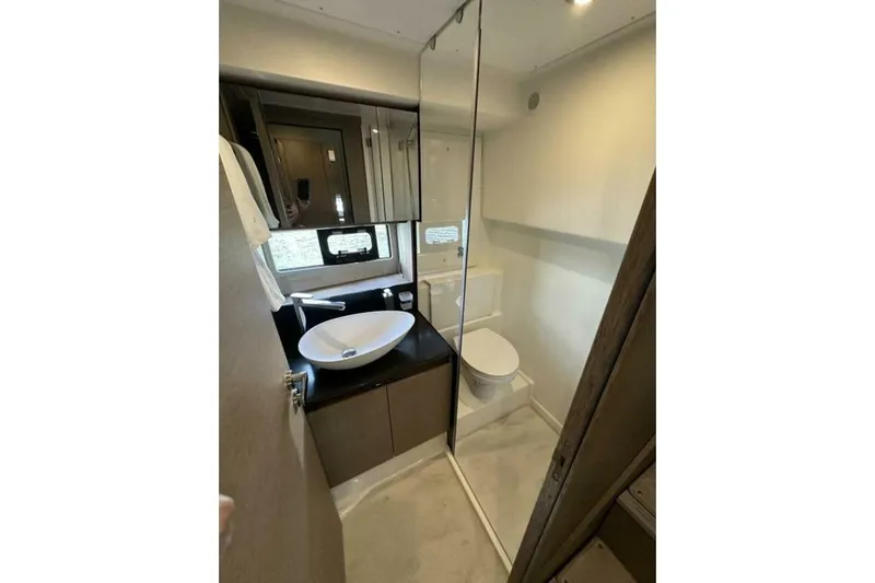 Our Trade Yacht Photos Pics Modern bathroom in 2024 Prestige 460 yacht, featuring sleek design and compact layout.