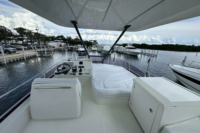 Our Trade Yacht Photos Pics Prestige 460 yacht, 2024 model, docked at marina with scenic water view.