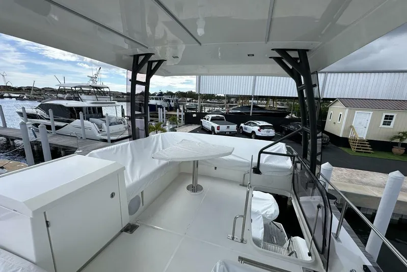 Our Trade Yacht Photos Pics Luxurious 2024 Prestige 460 yacht docked, featuring spacious seating and sleek design.