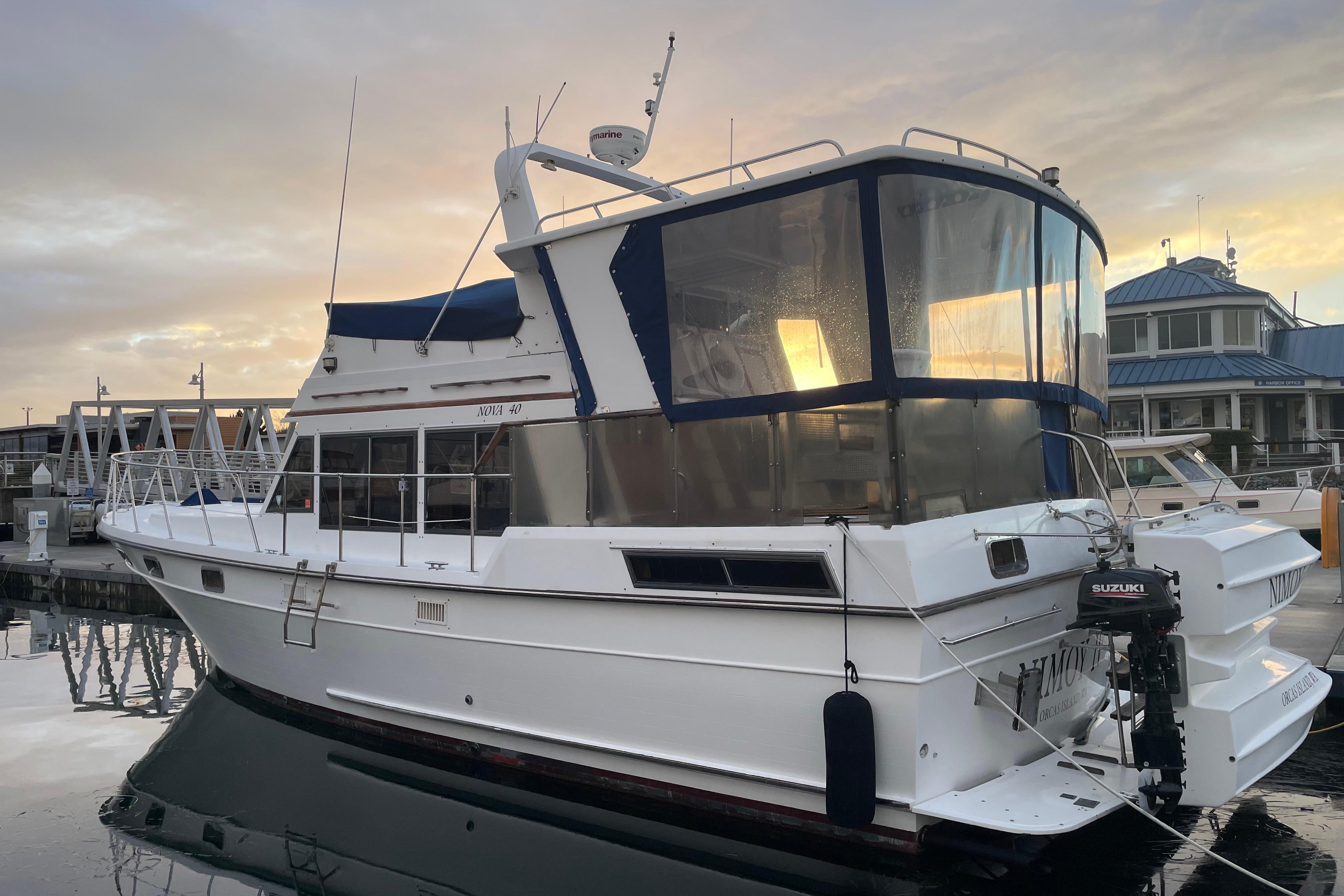 1985 Nova 40 Sundeck Aft Cabin yacht docked at sunset, featuring a sleek design.