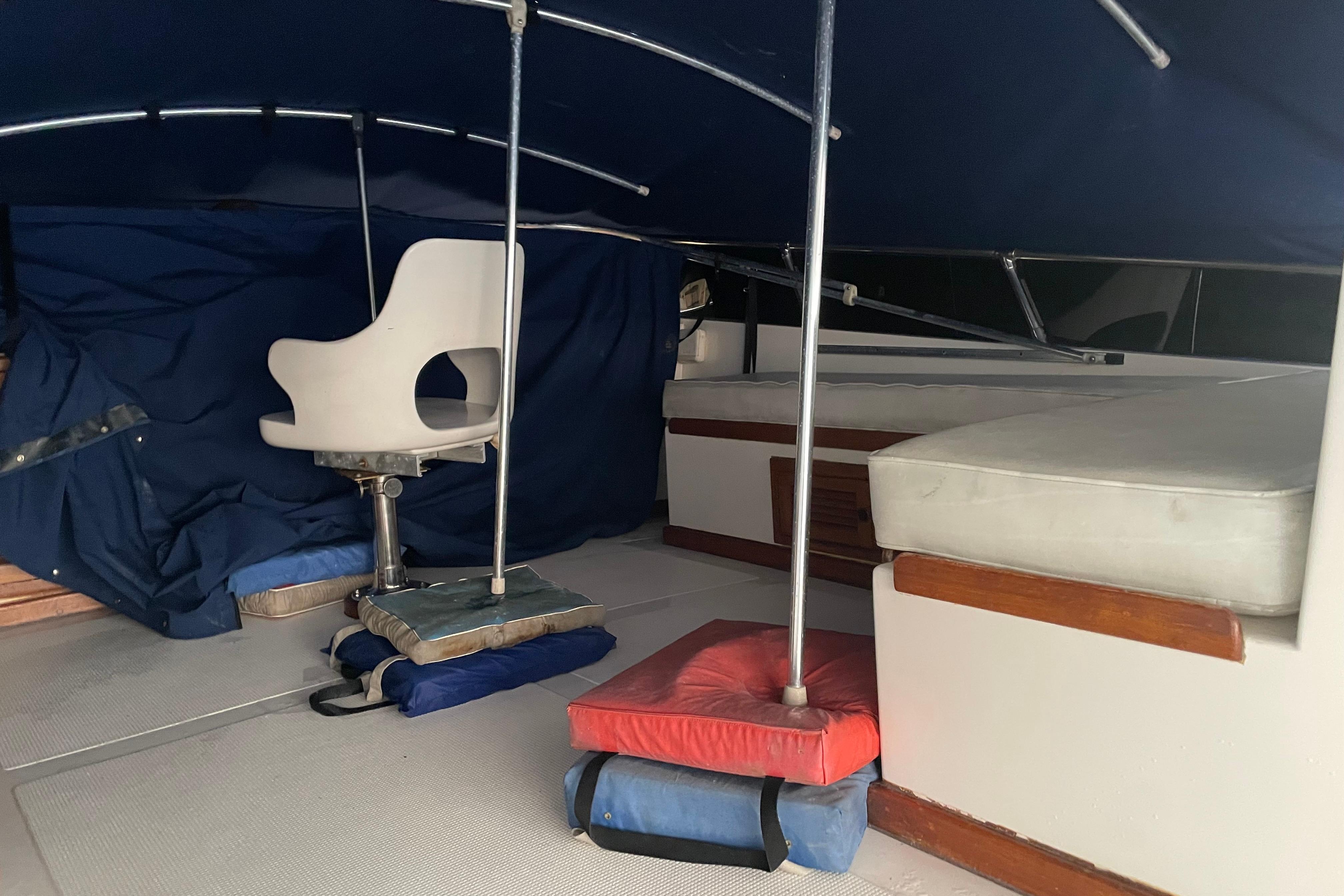 1985 Nova 40 Sundeck Aft Cabin interior with seating and cushions.