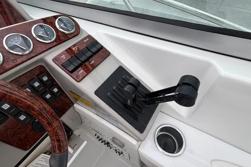  Yacht Photos Pics Control panel of a 2005 Formula 31 Performance Cruiser boat with throttle and gauges.