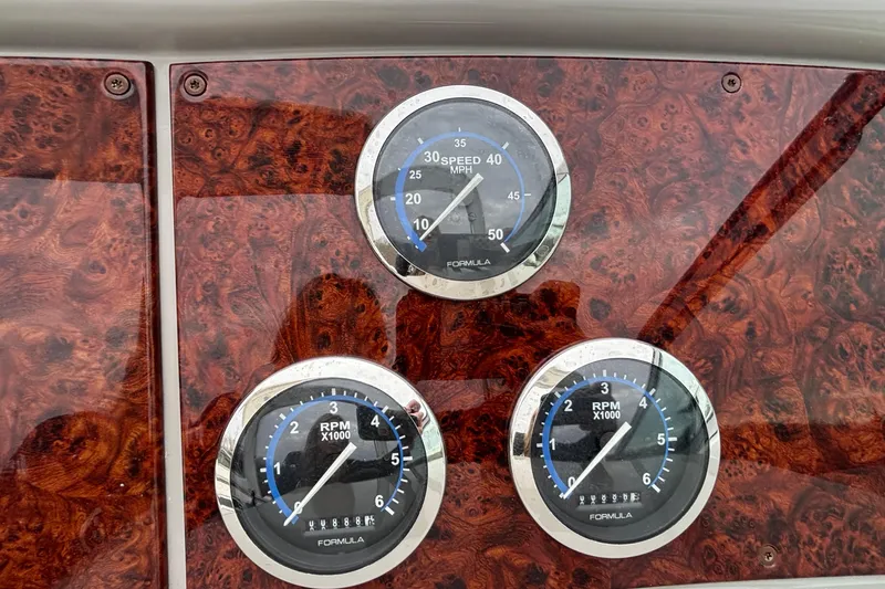  Yacht Photos Pics Dashboard of 2005 Formula 31 Performance Cruiser with speedometer and RPM gauges.