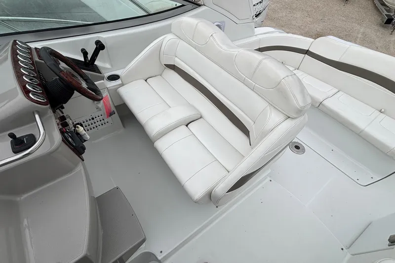  Yacht Photos Pics 2005 Formula 31 Performance Cruiser interior with white seating and steering wheel.