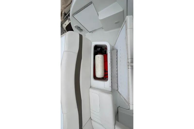  Yacht Photos Pics 2005 Formula 31 Performance Cruiser interior storage compartment with white seating.