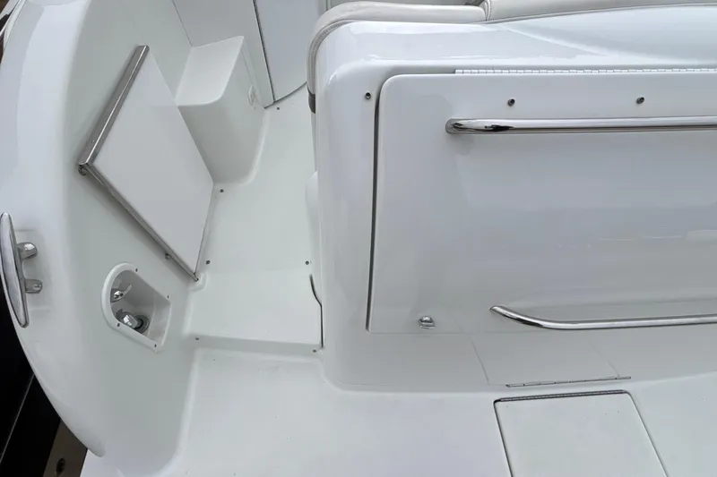  Yacht Photos Pics 2005 Formula 31 Performance Cruiser interior with white seating and chrome accents.