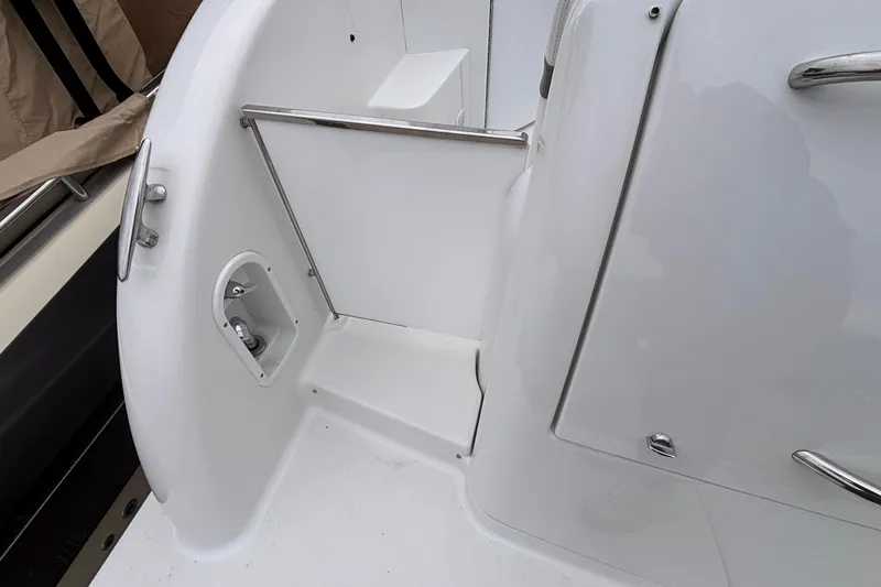  Yacht Photos Pics 2005 Formula 31 Performance Cruiser deck with stainless steel railings and clean white finish.