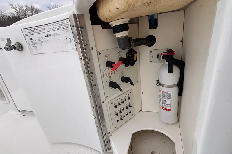  Yacht Photos Pics Control panel and fire extinguisher on 2005 Formula 31 Performance Cruiser boat.