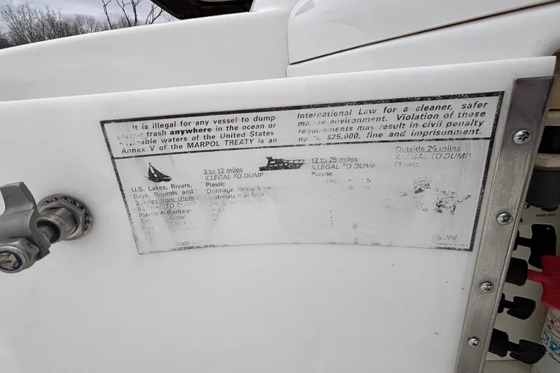  Yacht Photos Pics 2005 Formula 31 Performance Cruiser with MARPOL treaty compliance notice on waste disposal.