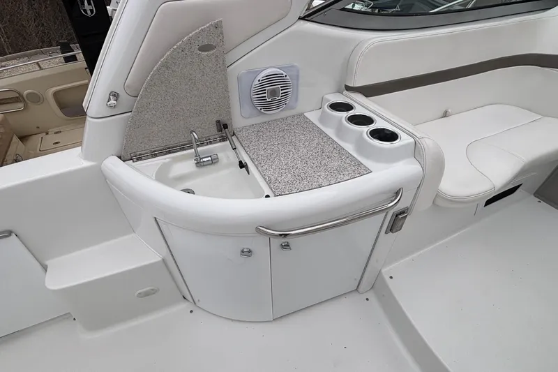  Yacht Photos Pics 2005 Formula 31 Performance Cruiser interior with sink and seating area.