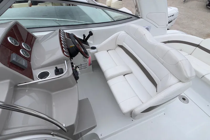  Yacht Photos Pics 2005 Formula 31 Performance Cruiser cockpit with white seating and control panel.