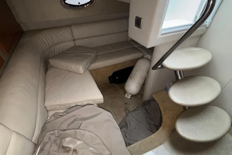  Yacht Photos Pics Interior of 2005 Formula 31 Performance Cruiser with beige seating and spiral staircase.