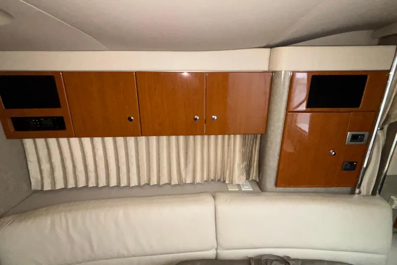  Yacht Photos Pics Interior of 2005 Formula 31 Performance Cruiser with wood cabinets and beige seating.