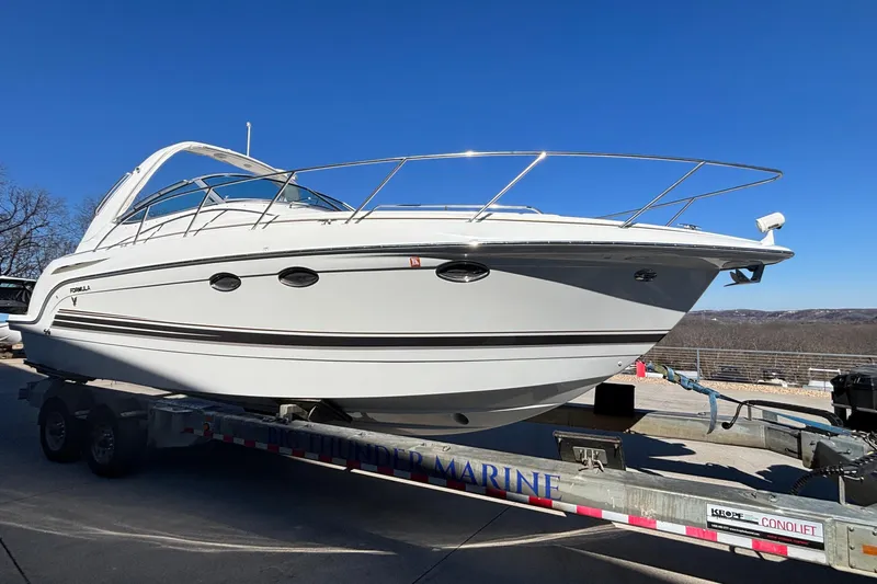  Yacht Photos Pics 2005 Formula 31 Performance Cruiser on trailer under clear blue sky.