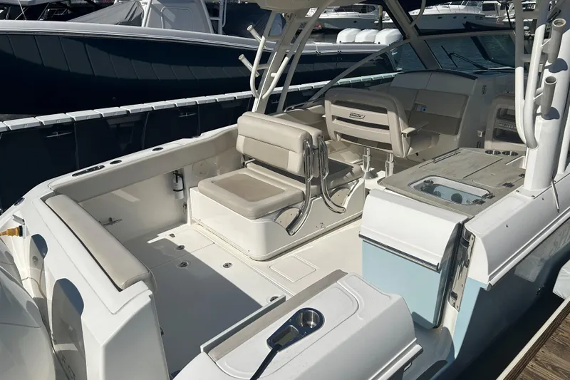Ship Happens Yacht Photos Pics 2018 Boston Whaler 320 Vantage boat interior with seating and fishing amenities.
