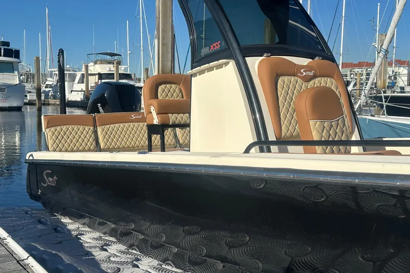 O-sea-d 2 Yacht Photos Pics 2021 Scout 251 XSS boat with luxurious seating at a marina.