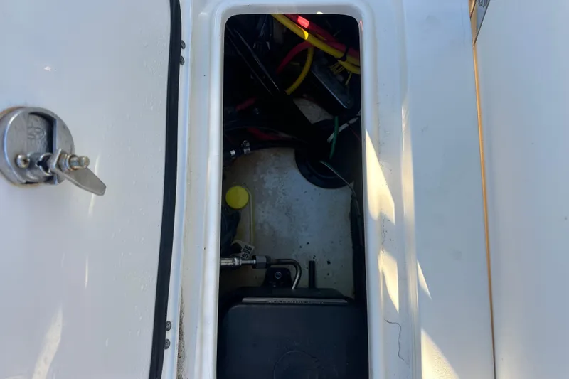 O-sea-d 2 Yacht Photos Pics 2021 Scout 251 XSS boat compartment with wiring and components.
