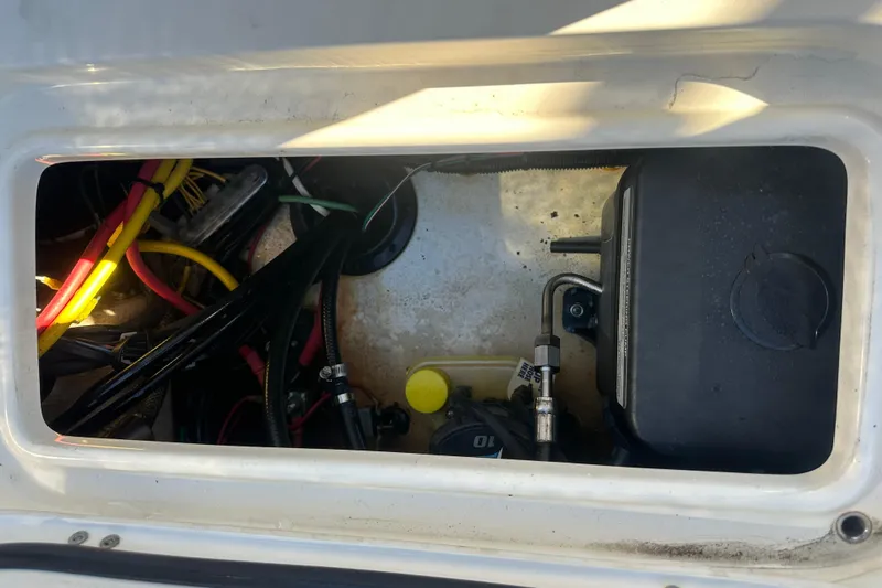 O-sea-d 2 Yacht Photos Pics 2021 Scout 251 XSS boat compartment with wiring and mechanical components.