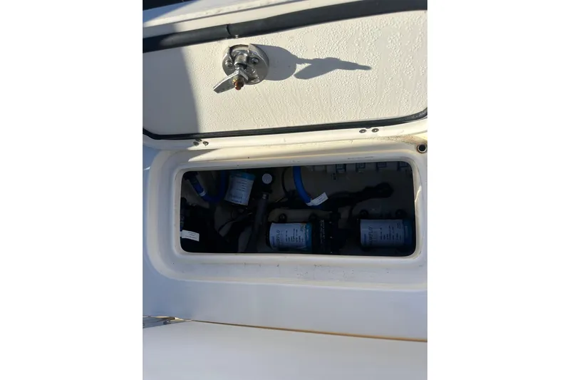 O-sea-d 2 Yacht Photos Pics 2021 Scout 251 XSS boat compartment with visible wiring and components.