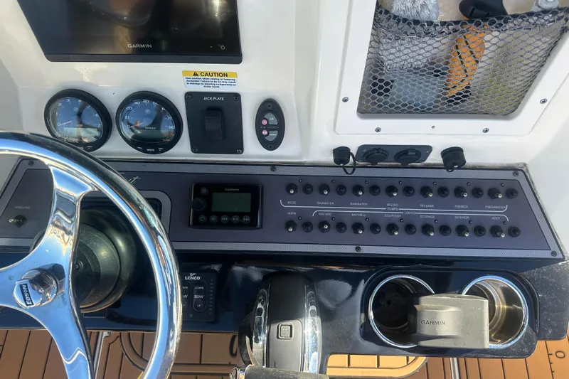 O-sea-d 2 Yacht Photos Pics 2021 Scout 251 XSS boat dashboard with Garmin display and control panel.