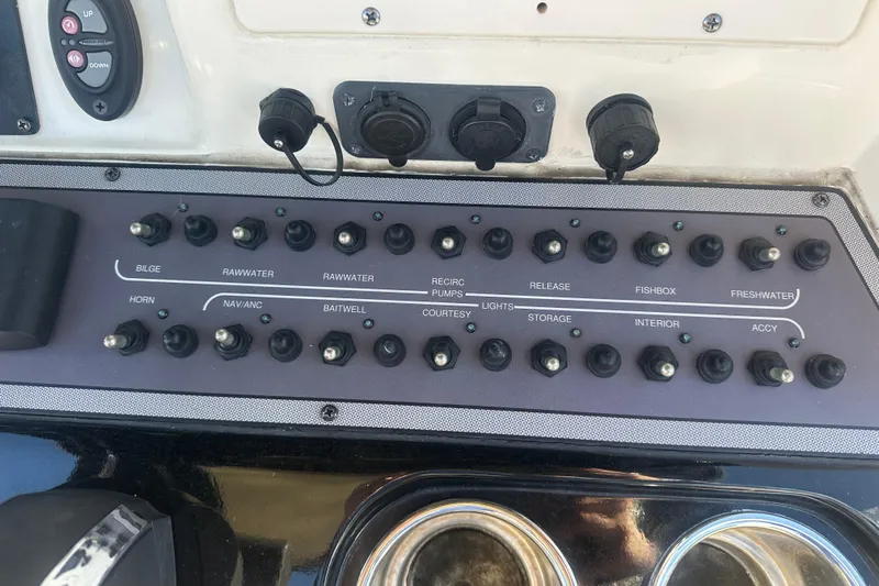 O-sea-d 2 Yacht Photos Pics Control panel of a 2021 Scout 251 XSS boat with labeled switches.