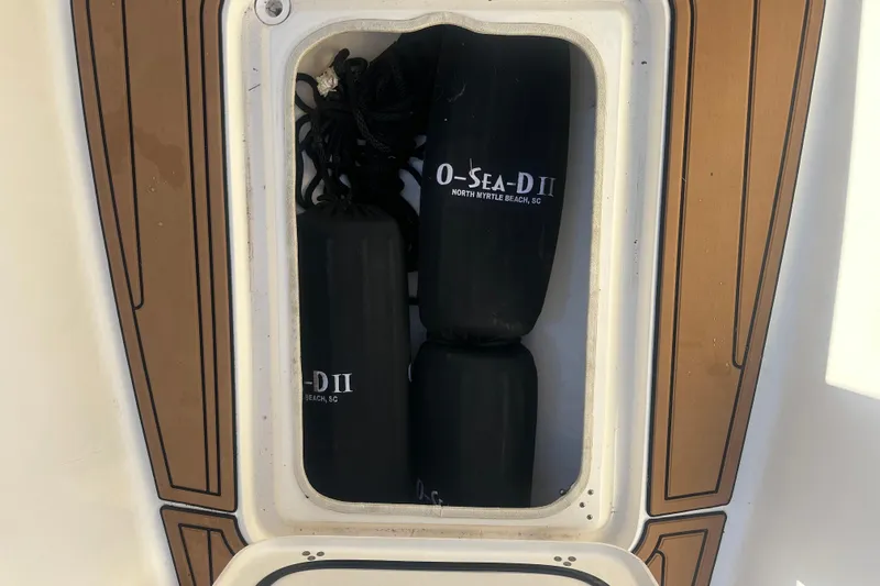 O-sea-d 2 Yacht Photos Pics Storage compartment on a 2021 Scout 251 XSS boat with fenders inside.