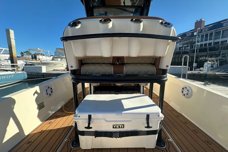 O-sea-d 2 Yacht Photos Pics 2021 Scout 251 XSS boat interior with Yeti cooler on deck.