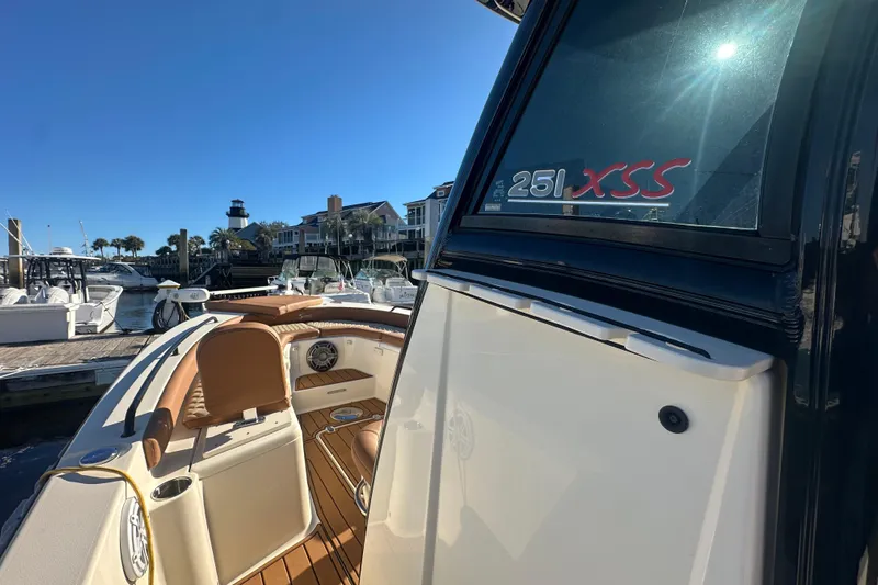 O-sea-d 2 Yacht Photos Pics 2021 Scout 251 XSS boat docked at marina with lighthouse in background.