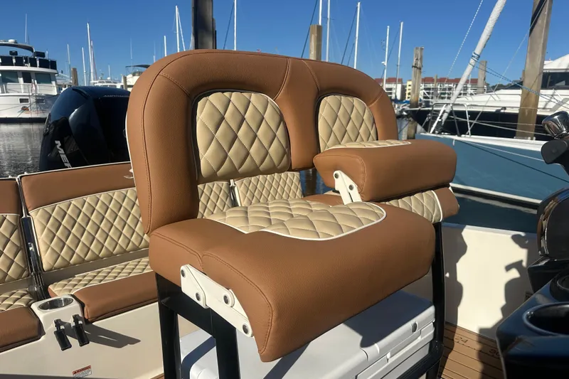 O-sea-d 2 Yacht Photos Pics 2021 Scout 251 XSS boat with luxurious tan and cream quilted seating.