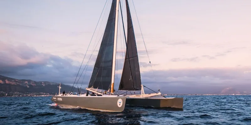 Maxicat Victoria Yacht Photos Pics Fast Cruising Conversion Maxi Catamaran sailing at sunset, Multiplast 2000 model.