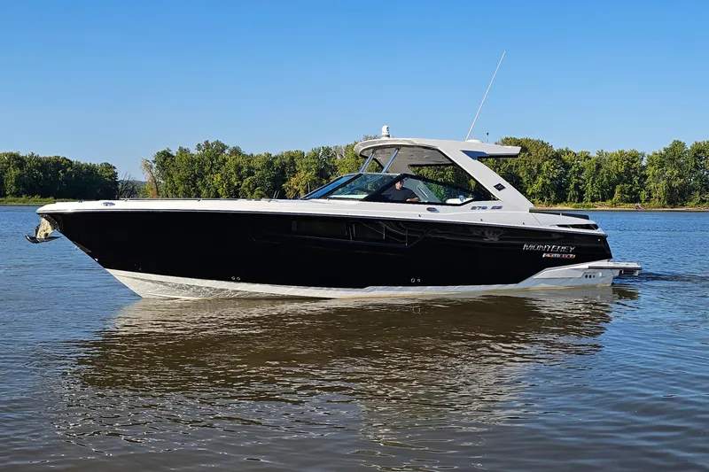  Yacht Photos Pics 2022 Monterey 378SS Super Sport boat cruising on a calm river with forested background.
