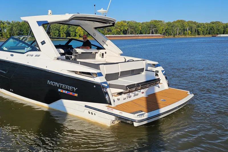  Yacht Photos Pics 2022 Monterey 378SS Super Sport boat on calm water, featuring sleek design and spacious deck.