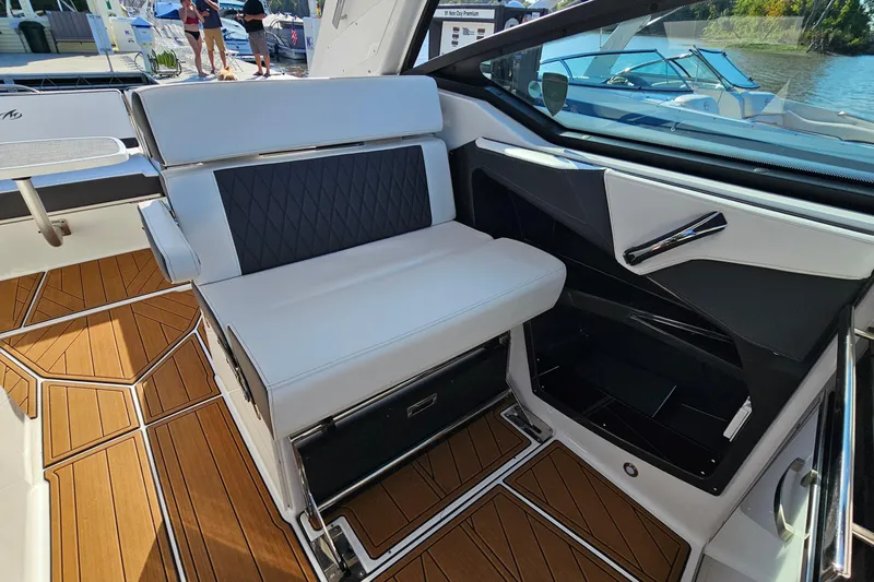  Yacht Photos Pics 2022 Monterey 378SS Super Sport interior with sleek seating and wood-patterned flooring.