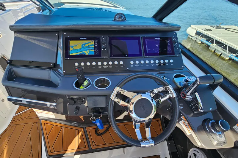  Yacht Photos Pics 2022 Monterey 378SS Super Sport boat dashboard with navigation screens and steering wheel.