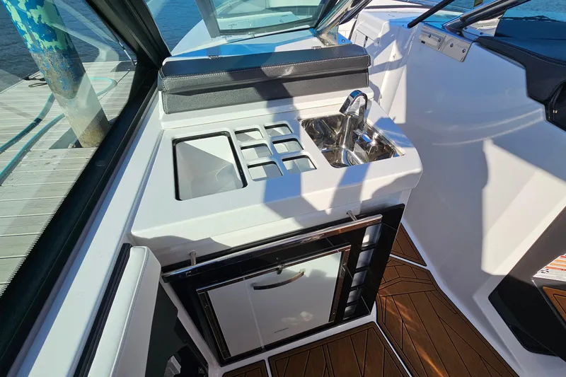  Yacht Photos Pics 2022 Monterey 378SS Super Sport boat interior with sink and storage area.