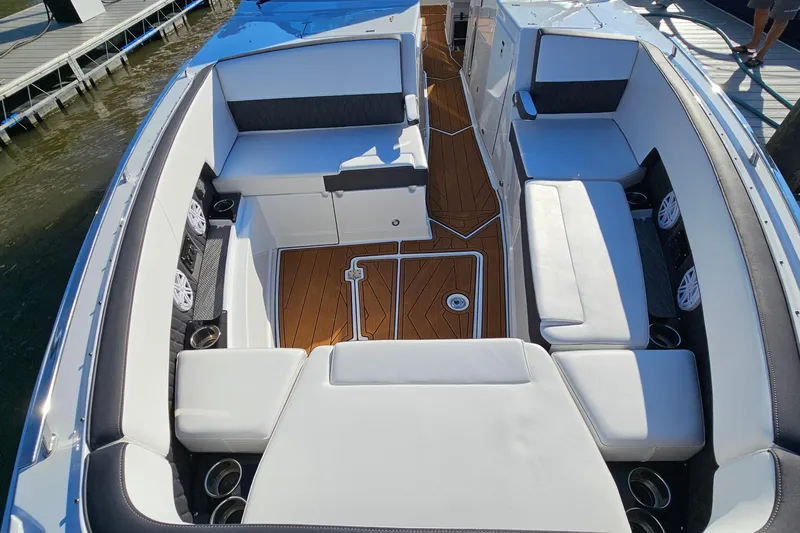  Yacht Photos Pics 2022 Monterey 378SS Super Sport boat interior with luxurious seating and wood flooring.