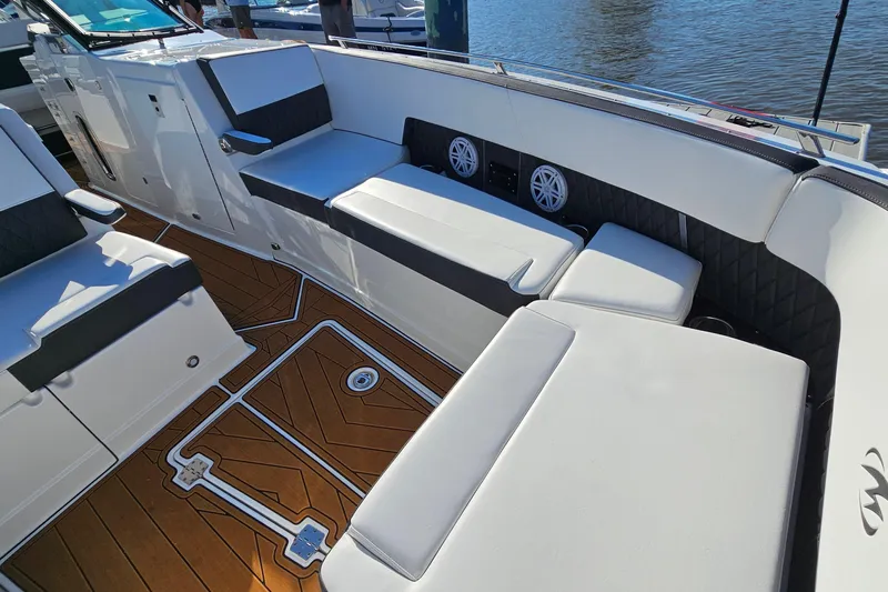  Yacht Photos Pics 2022 Monterey 378SS Super Sport boat interior with luxurious seating and teak flooring.