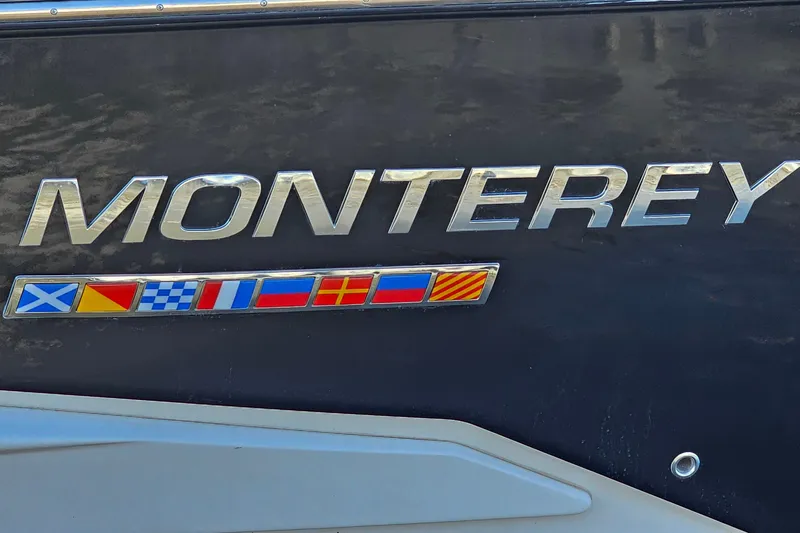  Yacht Photos Pics 2022 Monterey 378SS Super Sport boat logo with nautical flags on dark background.