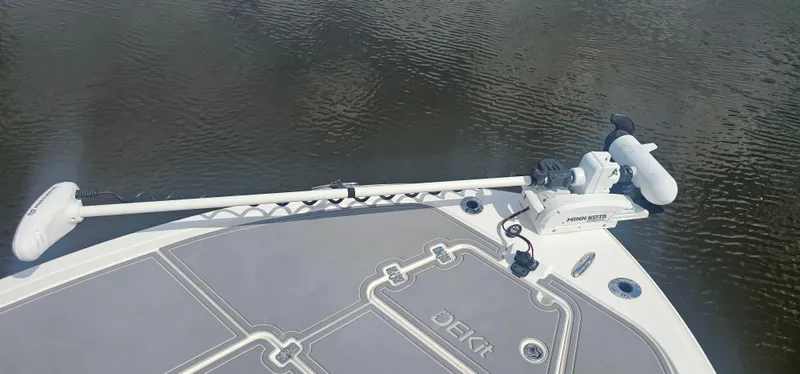  Yacht Photos Pics 2023 Caymas 28 HB Twin boat with Minn Kota trolling motor on calm water.